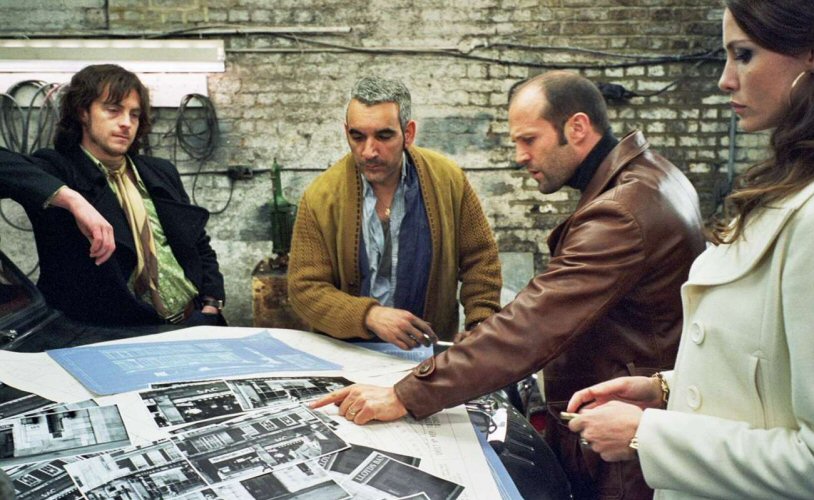 The gang plan the heist.