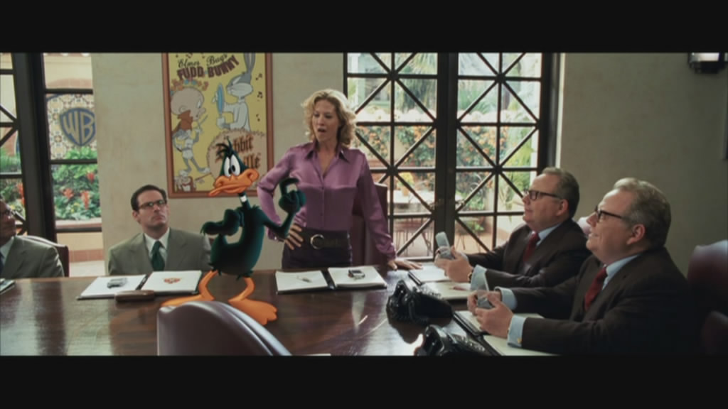Daffy pleads his case to the Brothers' Warner.