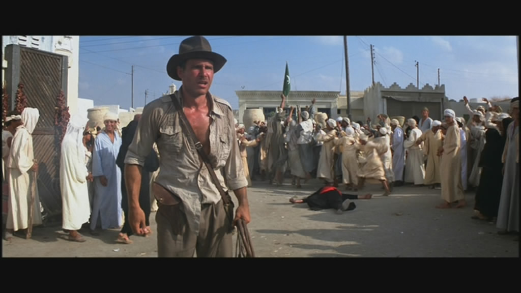 A she turned, the tune to "I Shot the Sherriff" went through his mind.
