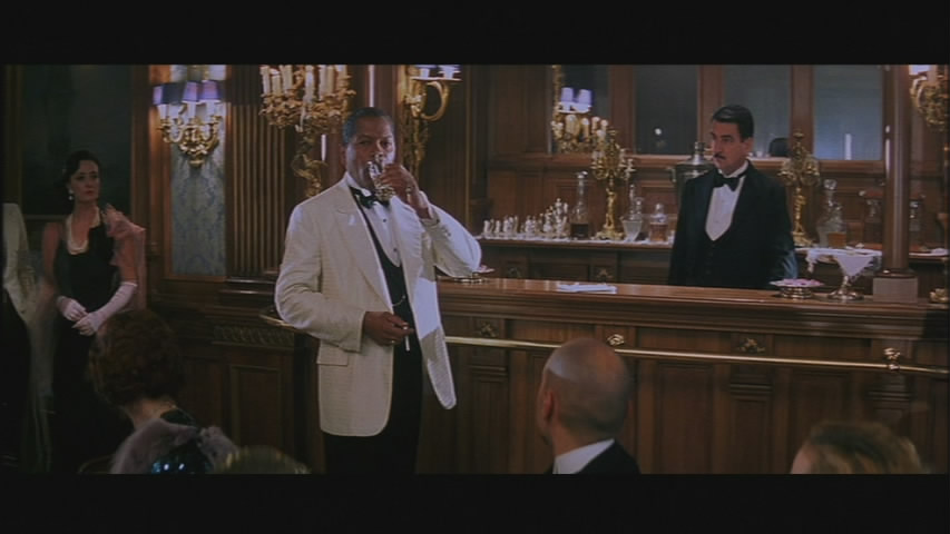 Jelly Roll Morton enjoys a drink. Before getting his ass kicked.