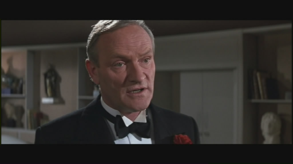 Walter Donovan explains the plot.