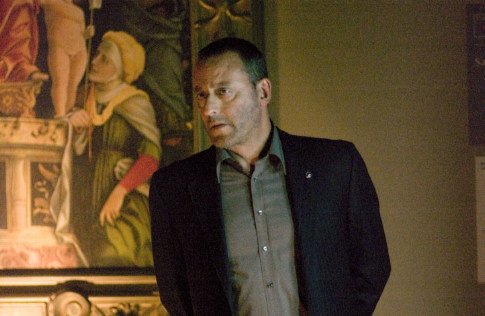 Jean Reno listens in on a conversation...