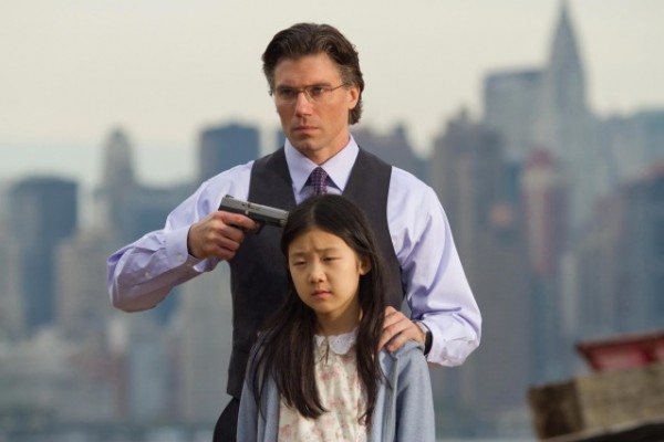 Oh sure, not everyone can look this cool pointing a gun at a little girl's head!